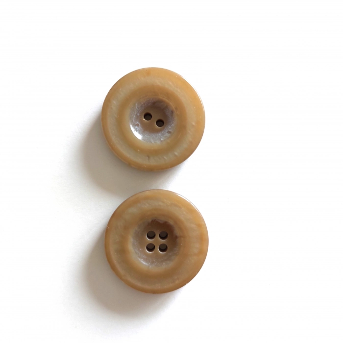 Mantel/Jackenknopf Kunst und Imitate